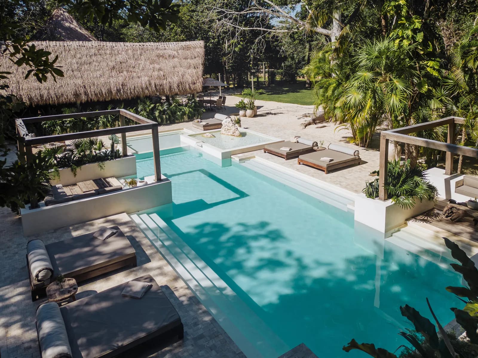 Onze Xpuha, jungle pool with daybeds and palapa shade