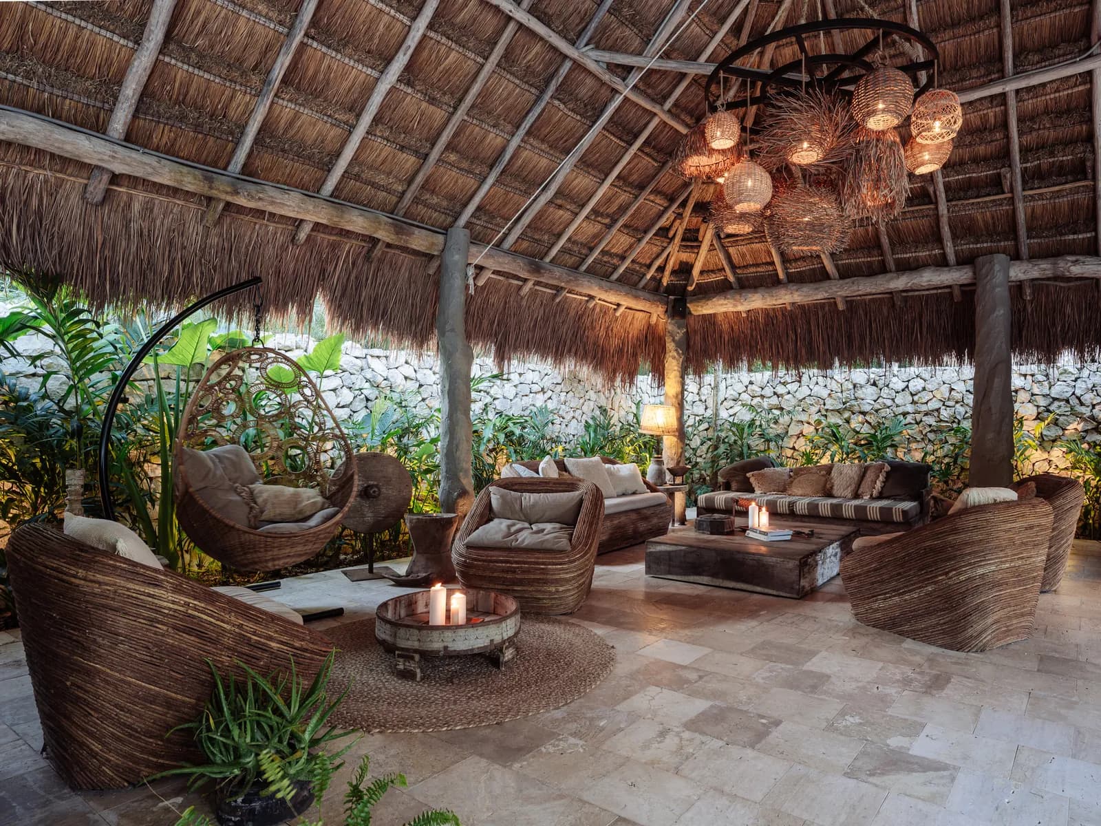 Onze Xpuha, palapa lounge with rattan chandeliers and hanging chairs