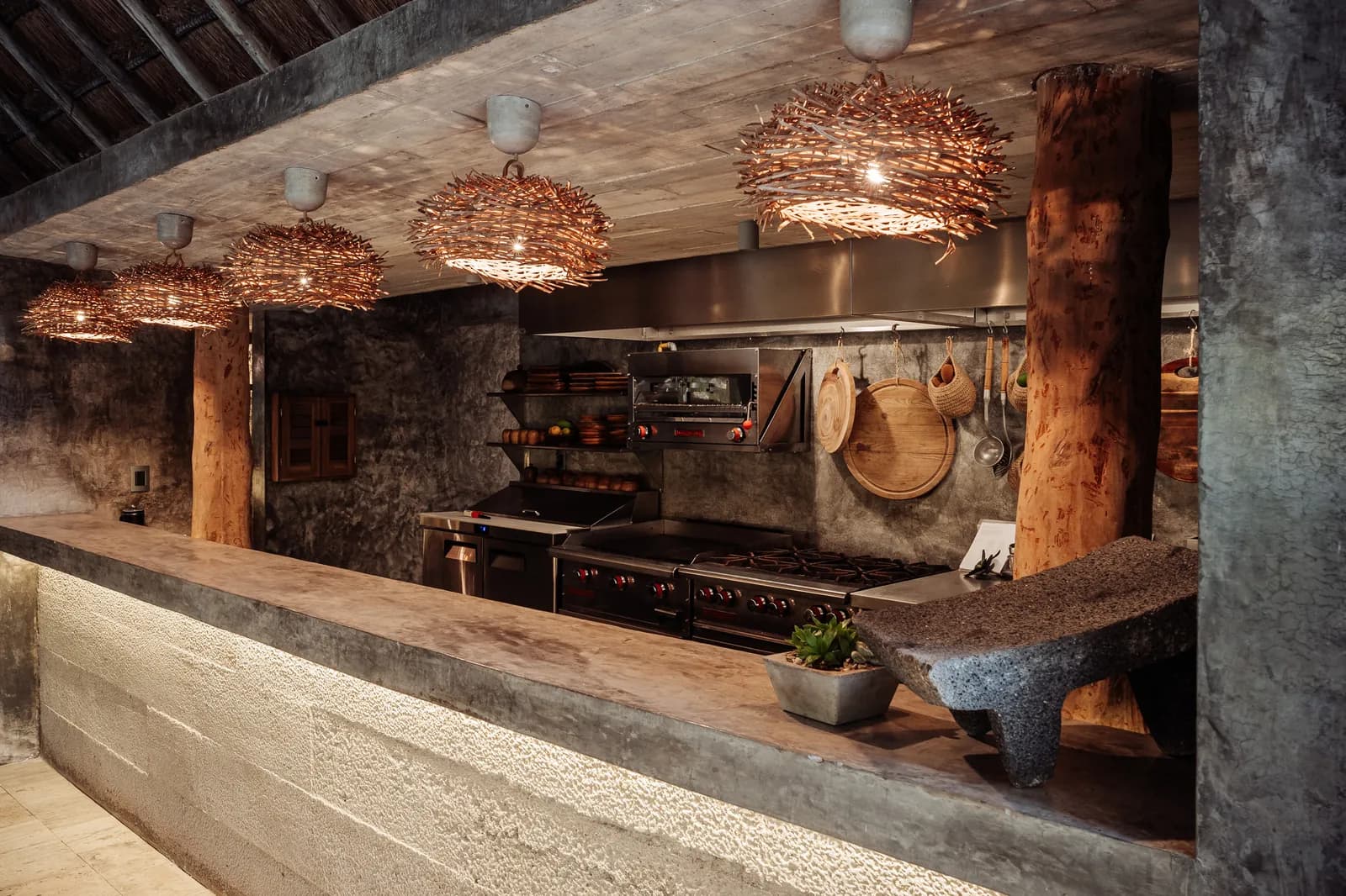Onze Xpuha, chef kitchen with woven pendants and concrete bar