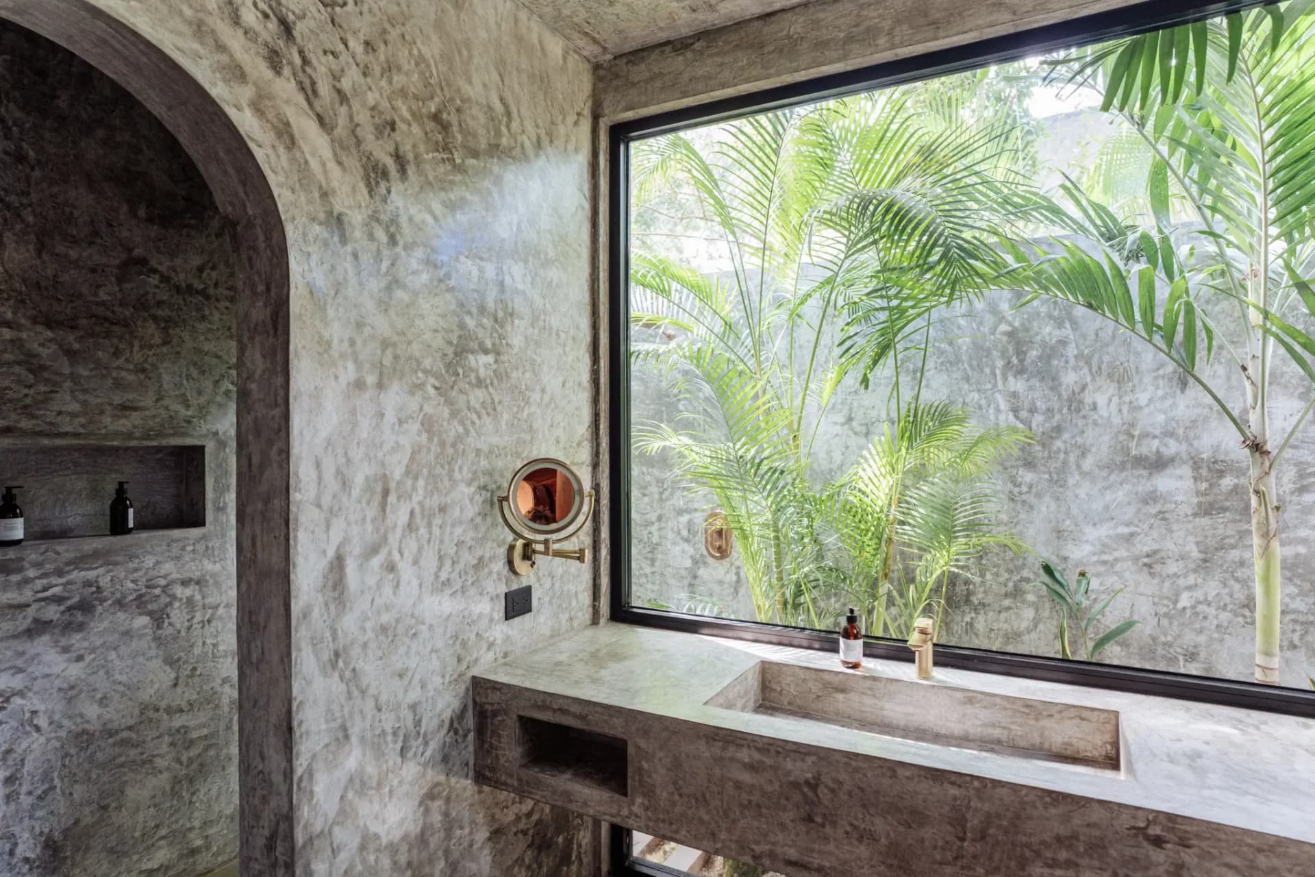 Onze Xpuha, concrete bathroom with jungle window view
